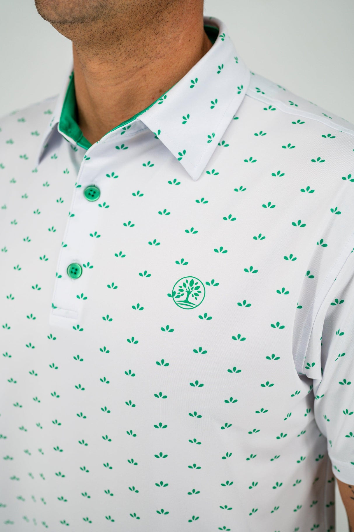 Moisture-Wicking White Golf Polo with Subtle Leaf Design